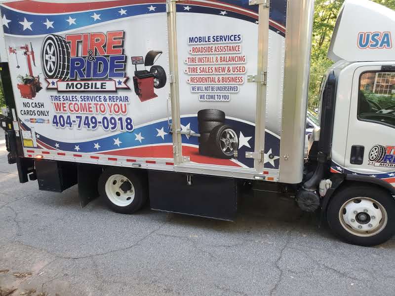 Tire & Ride Mobile — branded service box truck showing Atlanta phone 404-749-0918 and We Come To You slogan